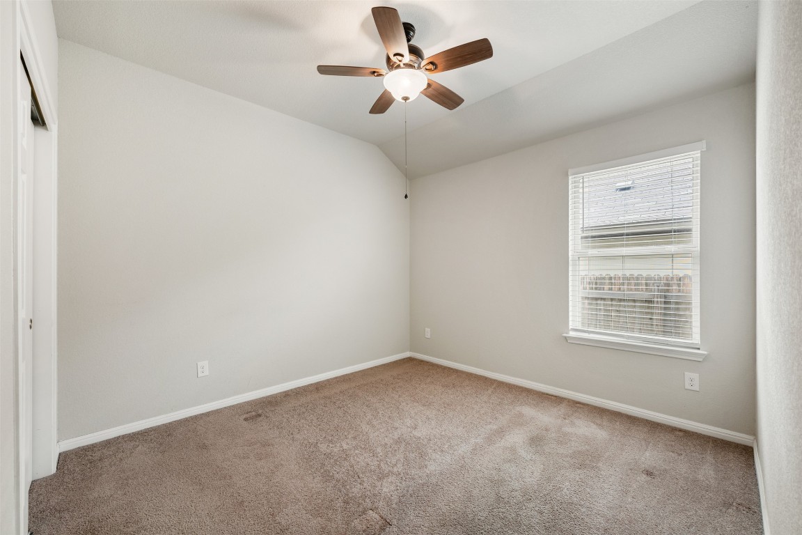 433 Rusk Bluff Avenue Leander, TX 78641 - Photo 17 of 22 Empty room with carpet, ceiling fan, and lofted ceiling