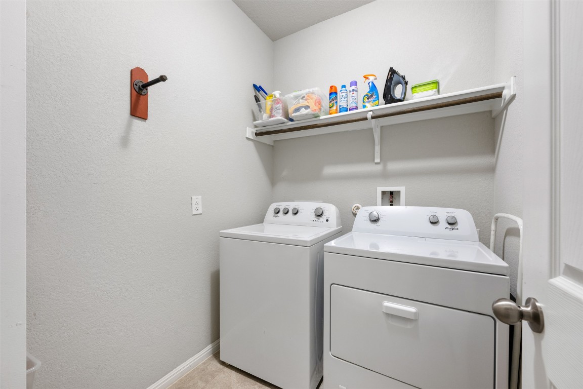 433 Rusk Bluff Avenue Leander, TX 78641 - Photo 19 of 22 Laundry room featuring separate washer and dryer and baseboards