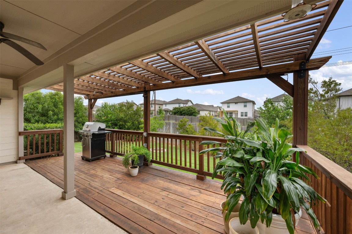 433 Rusk Bluff Avenue Leander, TX 78641 - Photo 20 of 22 Wooden deck featuring a pergola, area for grilling, a ceiling fan, and a residential view