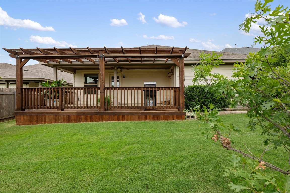 433 Rusk Bluff Avenue Leander, TX 78641 - Photo 22 of 22 Back of house with a pergola, a deck, roof with shingles, and ceiling fan