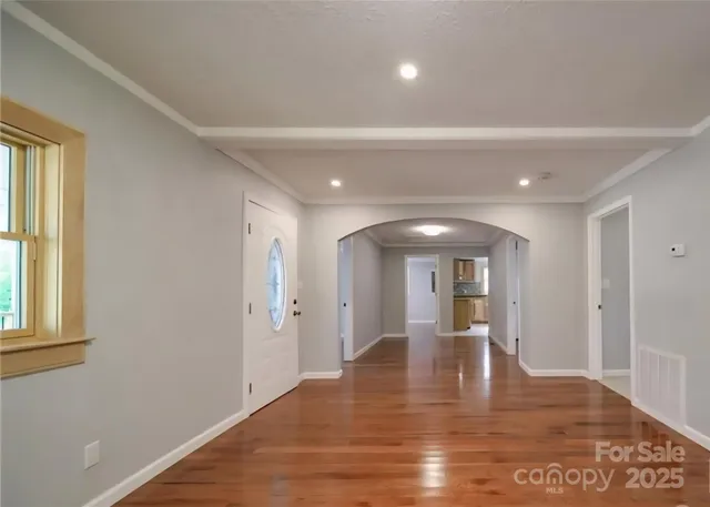 a kitchen with stainless steel appliances granite countertop a sink and a stove