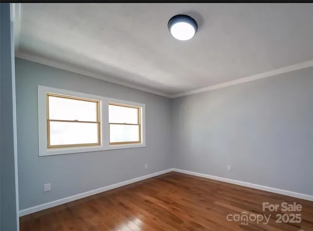 a view of a wooden deck with a yard