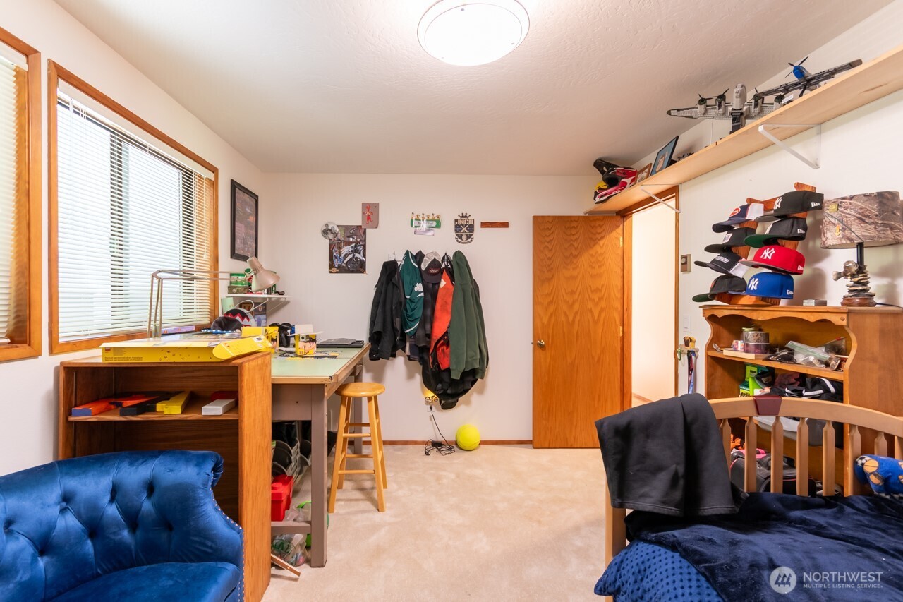 492 Walkabout Way Port Angeles, WA 98363 - Photo 29 of 40 a bedroom with bed and a window
