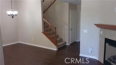 1510 Orange Avenue, Unit 205 Redlands, CA 92373 - Photo 12 of 27 a view of a hallway with wooden floor and staircase