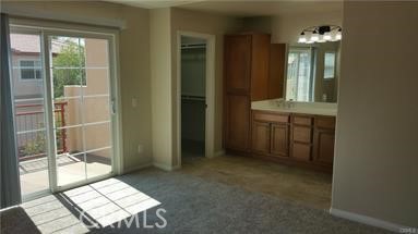 1510 Orange Avenue, Unit 205 Redlands, CA 92373 - Photo 15 of 27 view of an entryway with wooden floor and a mirror