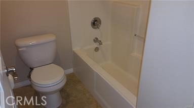 1510 Orange Avenue, Unit 205 Redlands, CA 92373 - Photo 21 of 27 a bathroom with a toilet and a shower