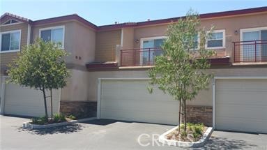 1510 Orange Avenue, Unit 205 Redlands, CA 92373 - Photo 22 of 27 a potted plant sitting in front of a house