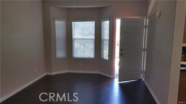 1510 Orange Avenue, Unit 205 Redlands, CA 92373 - Photo 4 of 27 an empty room with wooden floor and windows