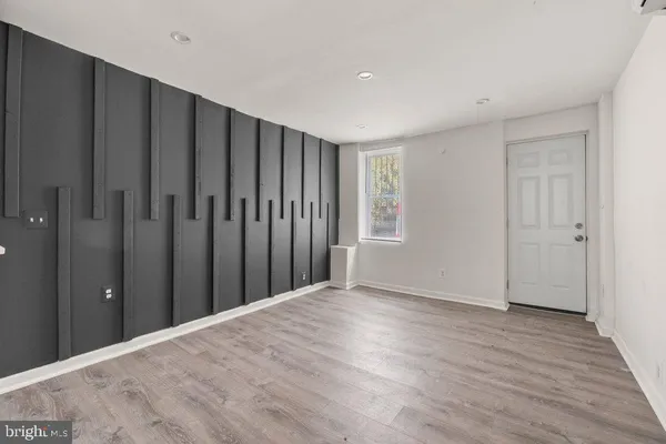 a view of a kitchen with wooden floor