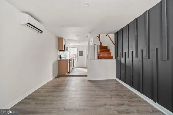 a kitchen with stainless steel appliances granite countertop a stove and a refrigerator