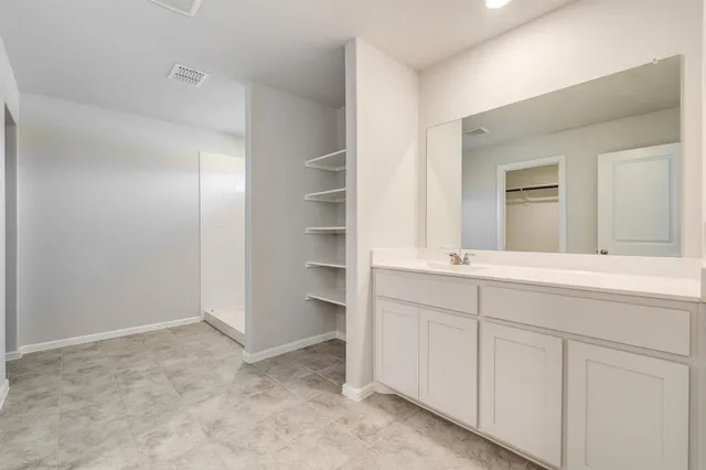 a view of a room with racks on the wall