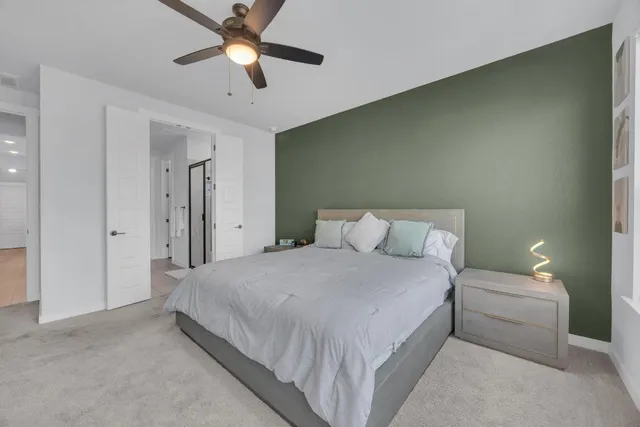 a kitchen with stainless steel appliances granite countertop wooden floors and white cabinets