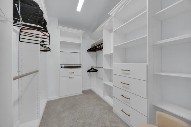 a bathroom with double sink and a mirror