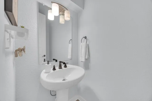 a view of a bathroom from a hallway