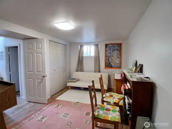 a bedroom with furniture and a window