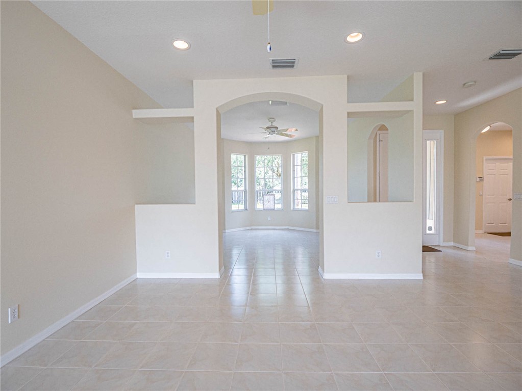 1422 Tradewinds Way Sebastian, FL 32958 - Photo 12 of 35 an entryway of a room and windows