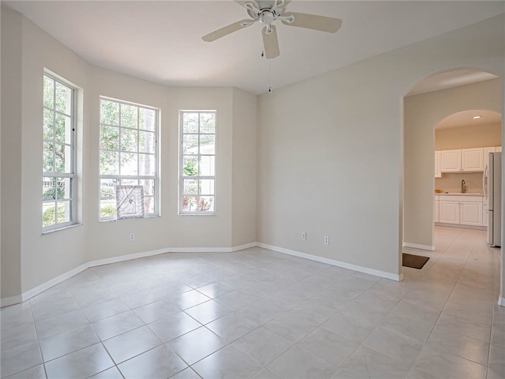 1422 Tradewinds Way Sebastian, FL 32958 - Photo 13 of 35 a view of an empty room with a window