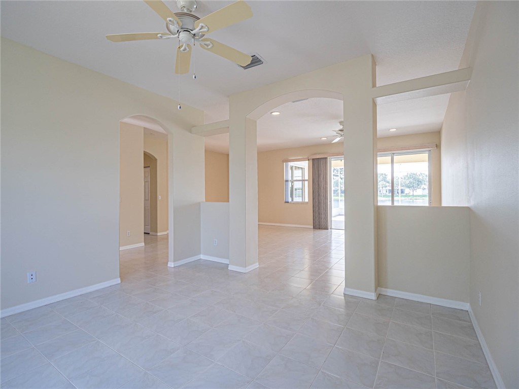 1422 Tradewinds Way Sebastian, FL 32958 - Photo 14 of 35 a view of an empty room with a window