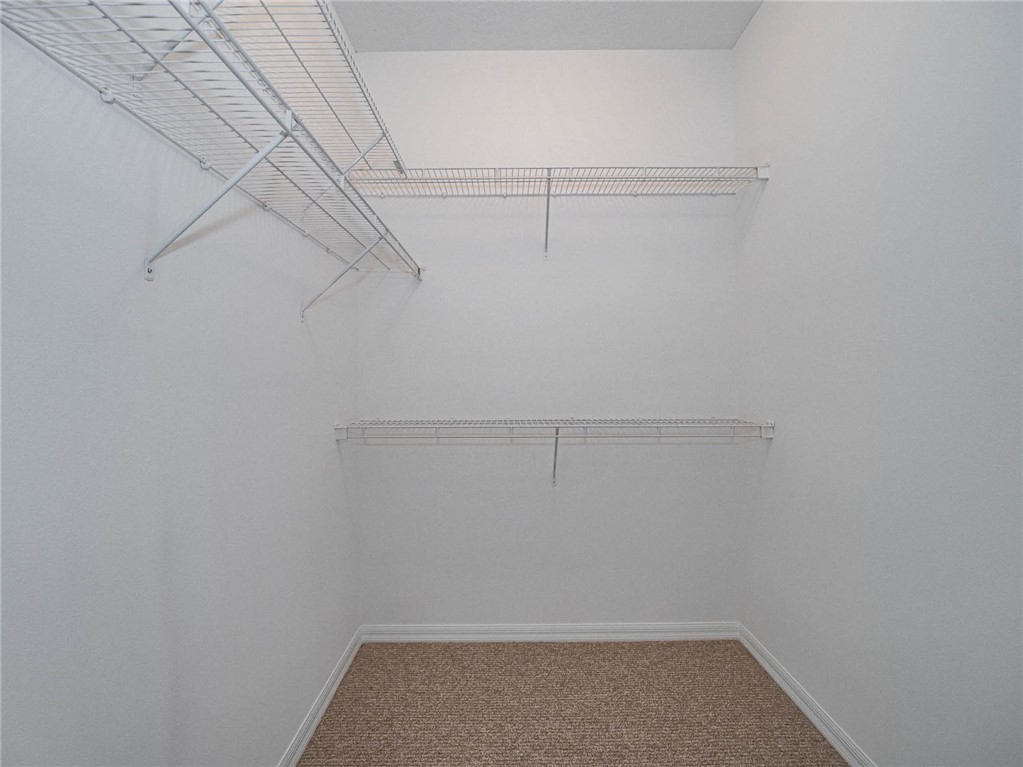 1422 Tradewinds Way Sebastian, FL 32958 - Photo 17 of 35 a view of a room with racks on the wall