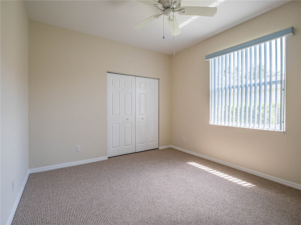 1422 Tradewinds Way Sebastian, FL 32958 - Photo 20 of 35 a view of an empty room with a window