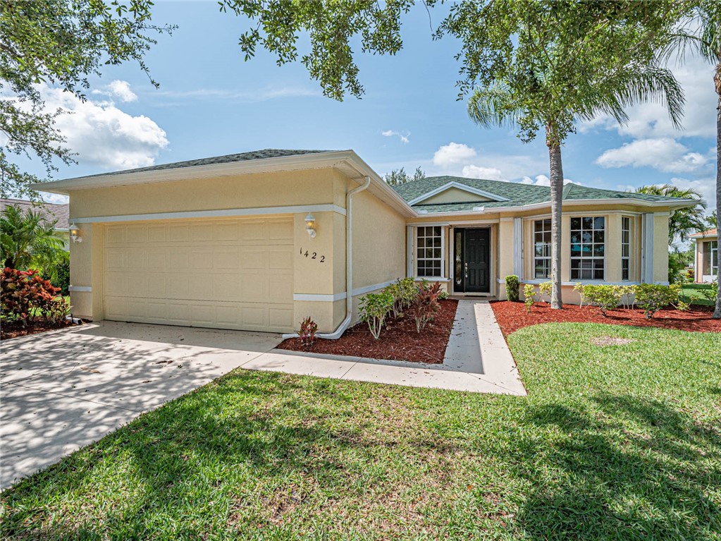 1422 Tradewinds Way Sebastian, FL 32958 - Photo 2 of 35 a view of a house with backyard and porch