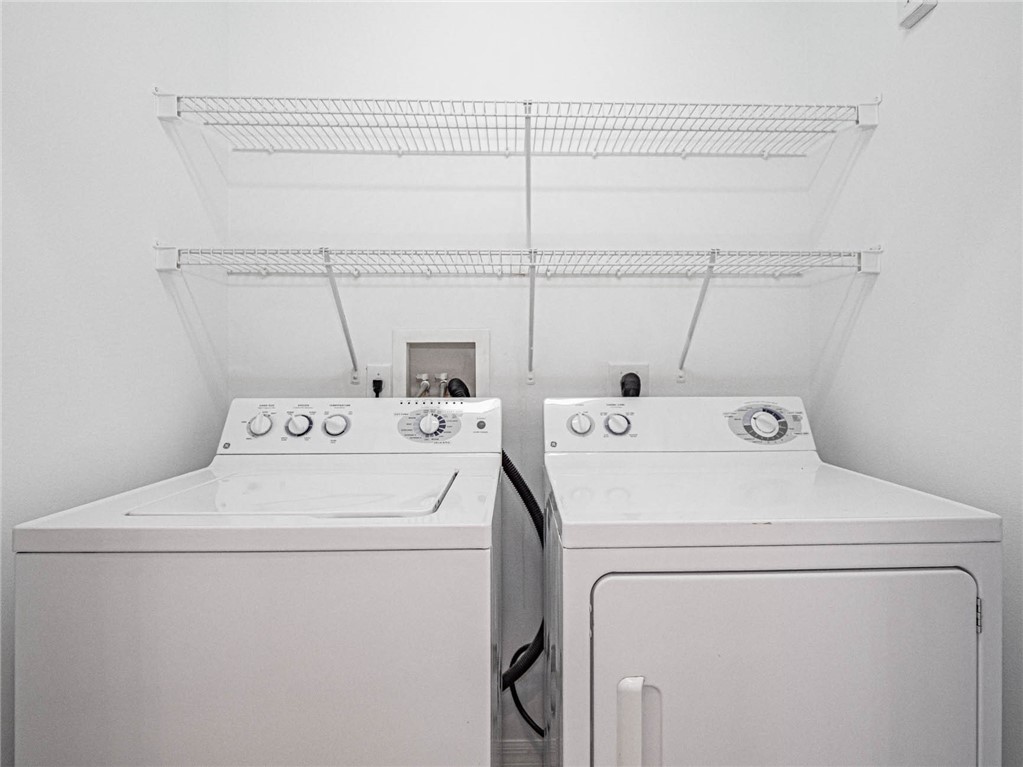 1422 Tradewinds Way Sebastian, FL 32958 - Photo 22 of 35 a utility room with dryer and washer