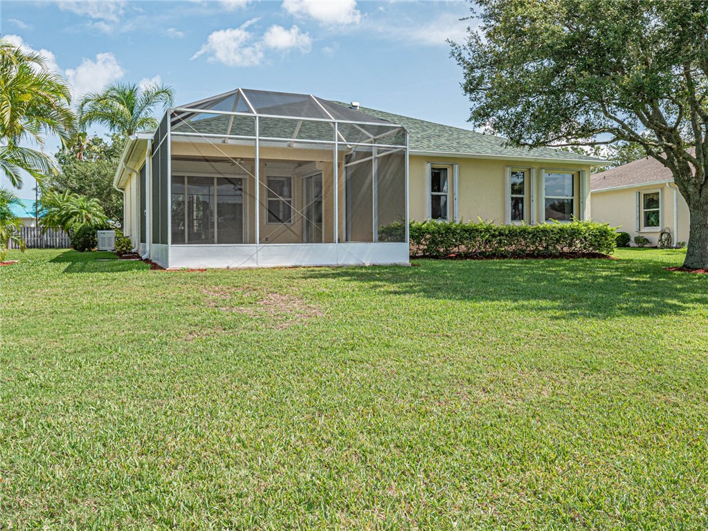 1422 Tradewinds Way Sebastian, FL 32958 - Photo 27 of 35 a view of a house with a yard