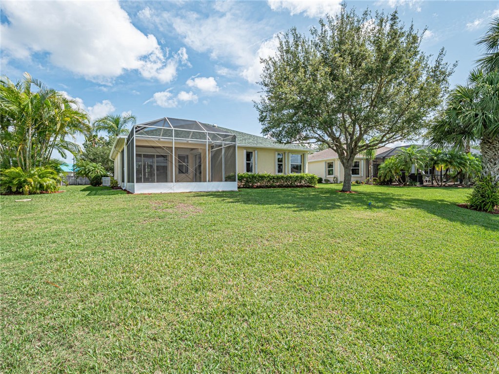 1422 Tradewinds Way Sebastian, FL 32958 - Photo 28 of 35 a front view of a house with a yard