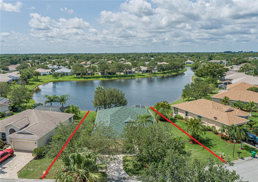 1422 Tradewinds Way Sebastian, FL 32958 - Photo 29 of 35 an aerial view of a house with a lake view