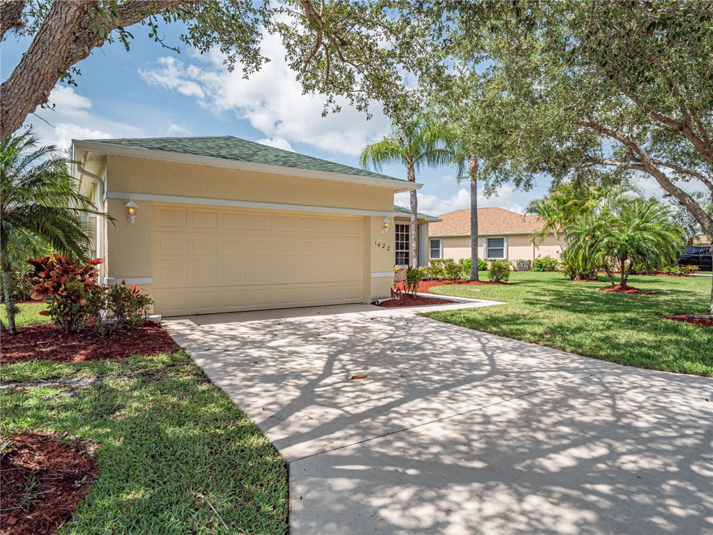 1422 Tradewinds Way Sebastian, FL 32958 - Photo 3 of 35 a view of a house with a yard