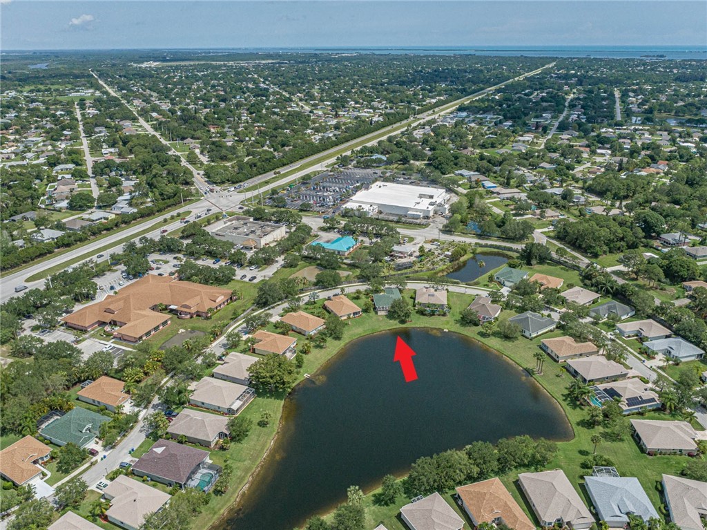 1422 Tradewinds Way Sebastian, FL 32958 - Photo 32 of 35 an aerial view of residential houses with outdoor space