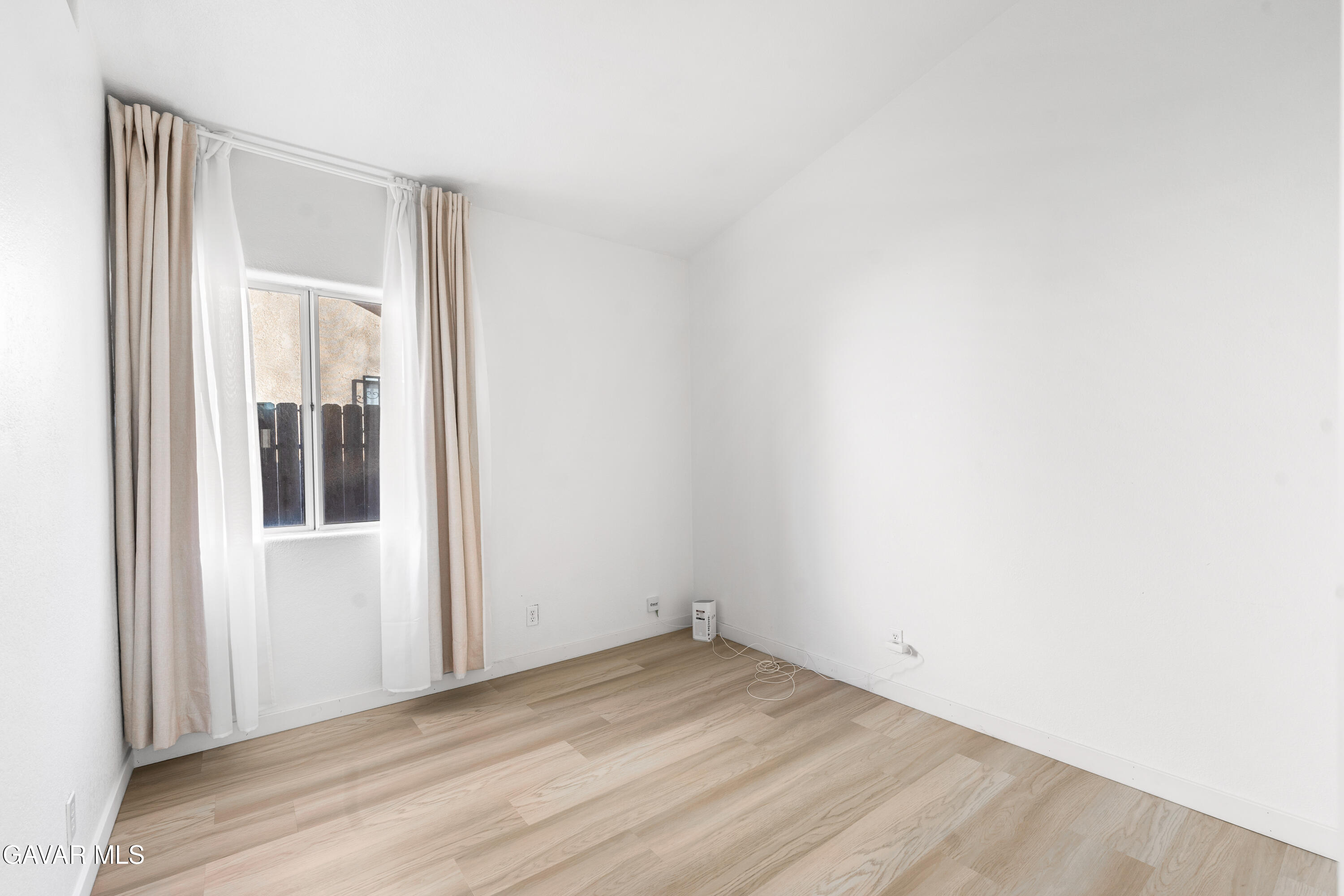 1639 East Kettering Street Lancaster, CA 93535 - Photo 19 of 35 a view of empty room with wooden floor
