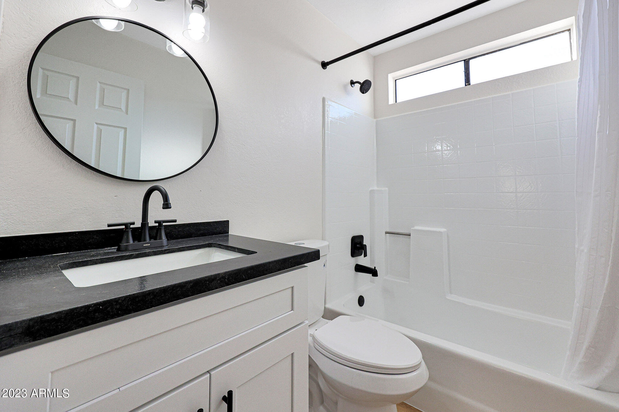613 West Rosemonte Drive Phoenix, AZ 85027 - Photo 15 of 24 a bathroom with a sink a toilet and a mirror