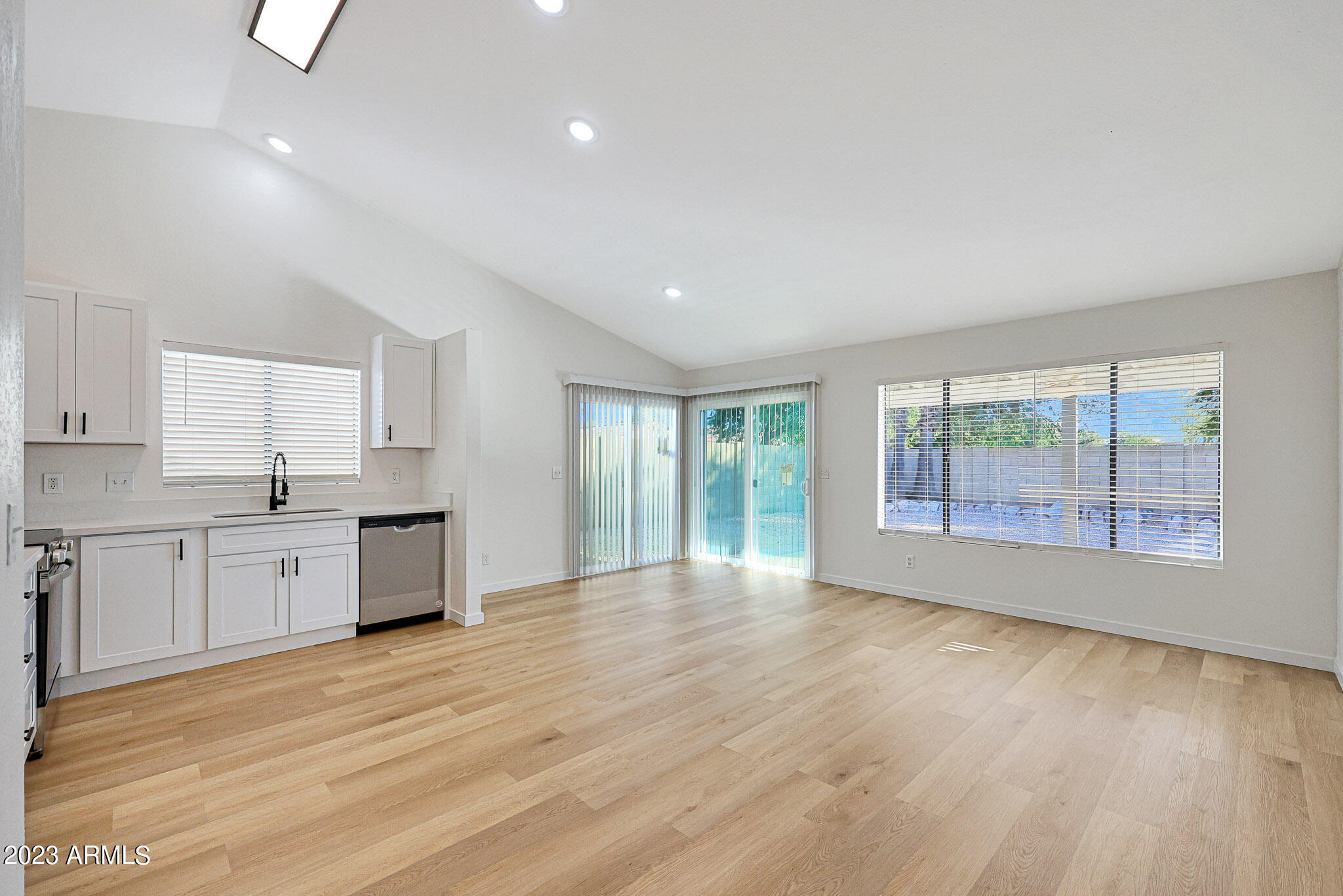 613 West Rosemonte Drive Phoenix, AZ 85027 - Photo 16 of 24 a large space with a large window and wooden floor