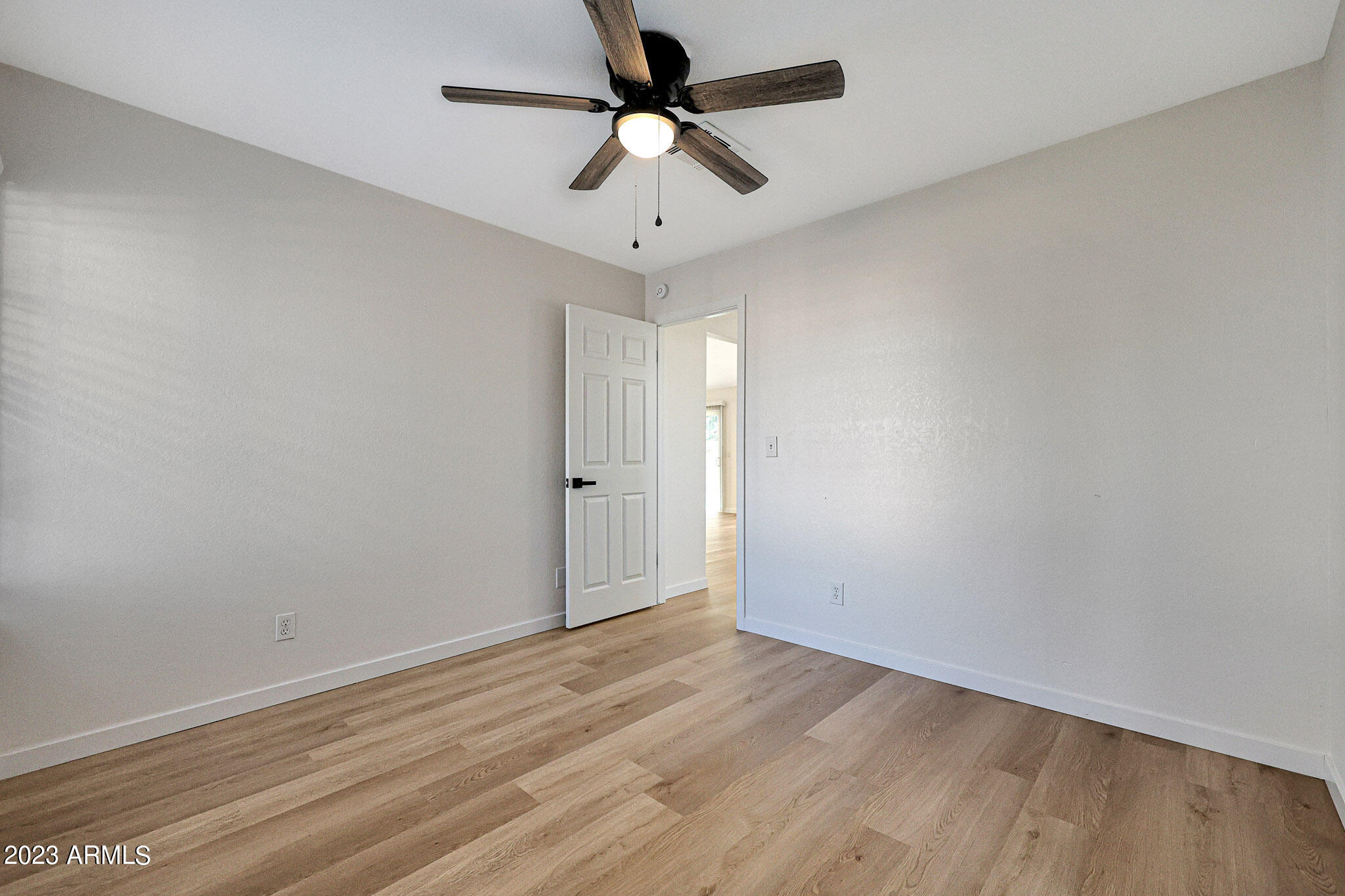 613 West Rosemonte Drive Phoenix, AZ 85027 - Photo 5 of 24 wooden floor in an empty room