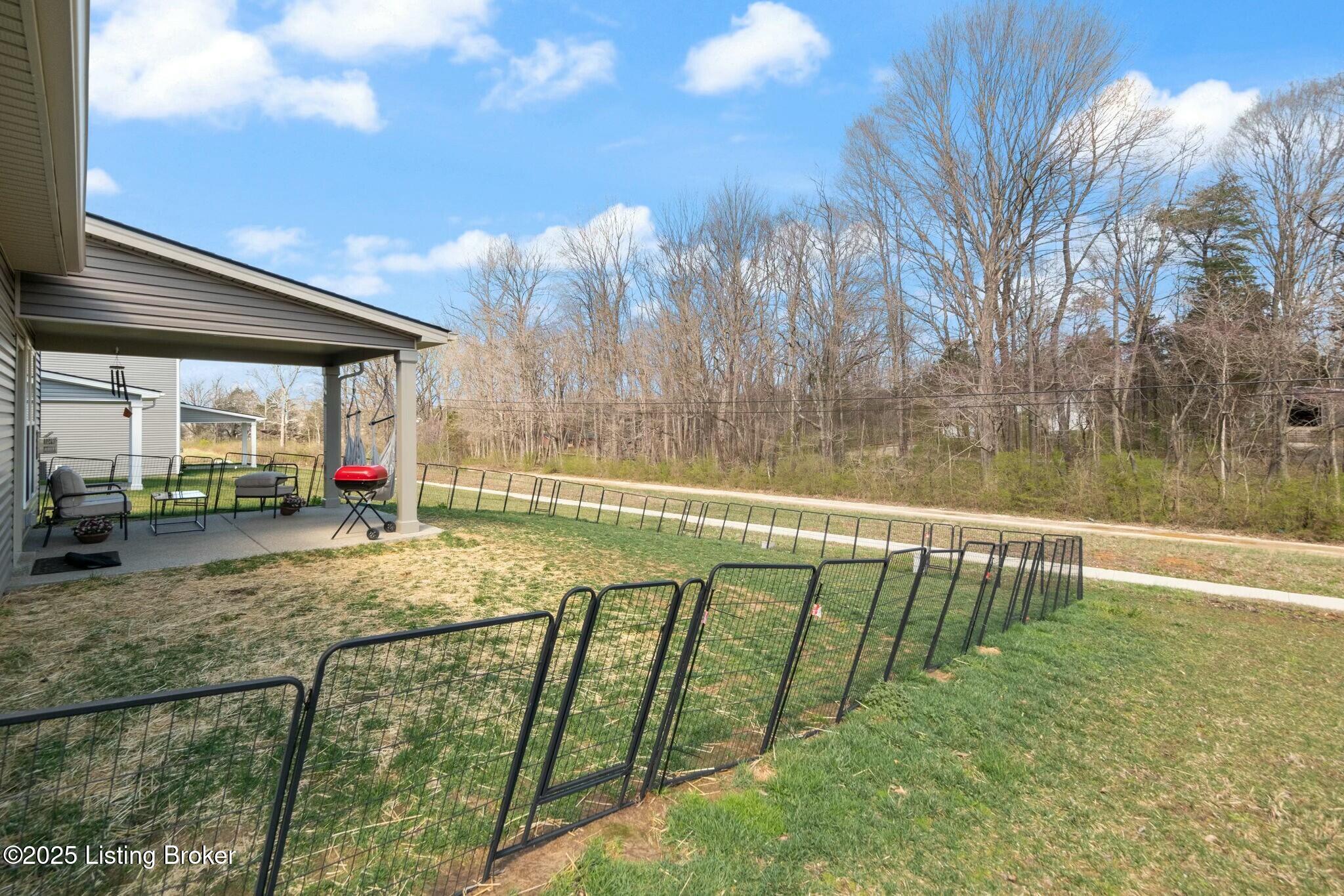 8428 Gateway Run Road Louisville, KY 40229 - Photo 57 of 63 This is a temporary fence and does not represent the property line. The yard is larger than the fenced area.