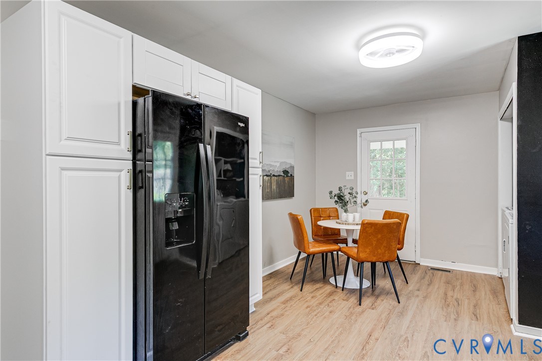 11211 Moravia Road Midlothian, VA 23112 - Photo 13 of 40 a dining room with furniture and wooden floor