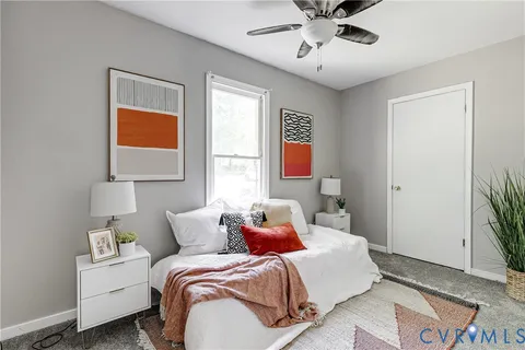 a bed room with a bed and a window
