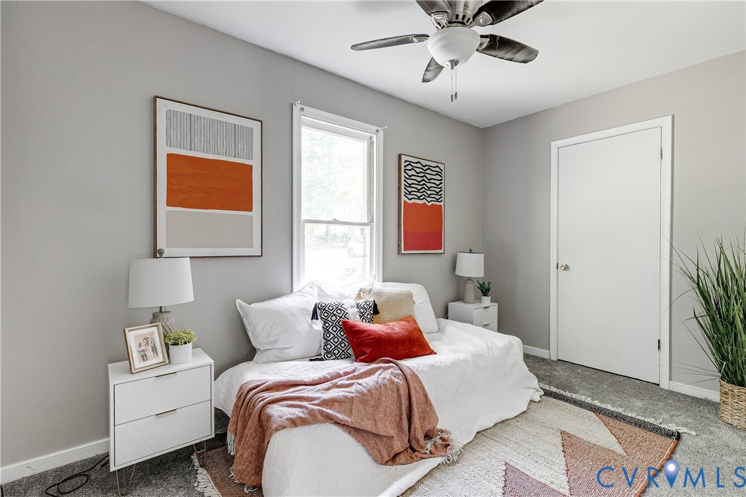 11211 Moravia Road Midlothian, VA 23112 - Photo 18 of 40 a bed room with a bed and a window