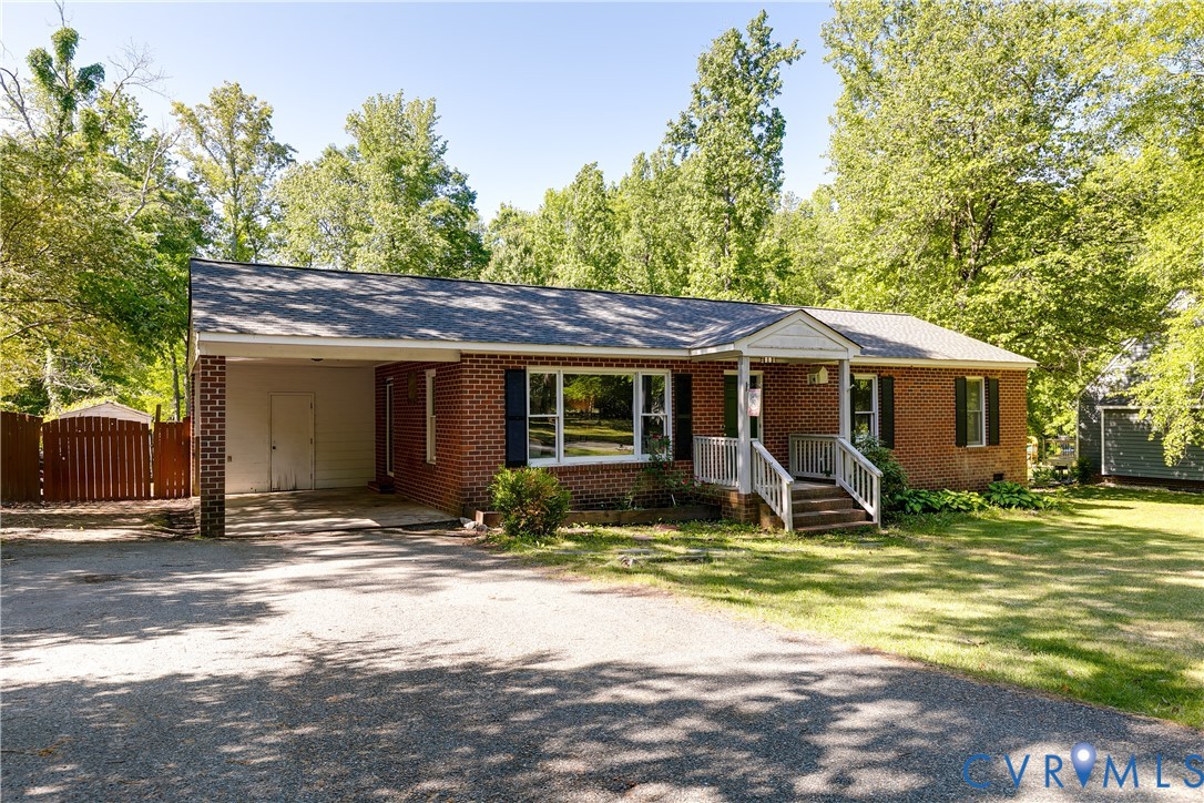 11211 Moravia Road Midlothian, VA 23112 - Photo 2 of 40 a view of a house with backyard porch and sitting area