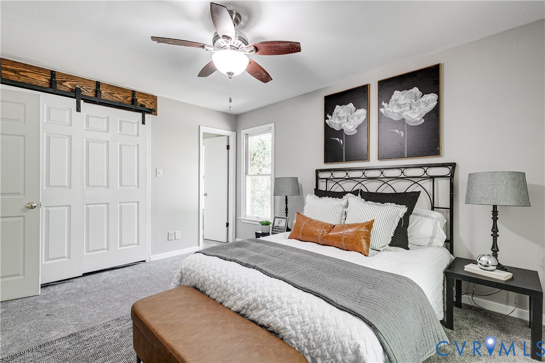 11211 Moravia Road Midlothian, VA 23112 - Photo 25 of 40 a bedroom with a bed and a painting on the wall