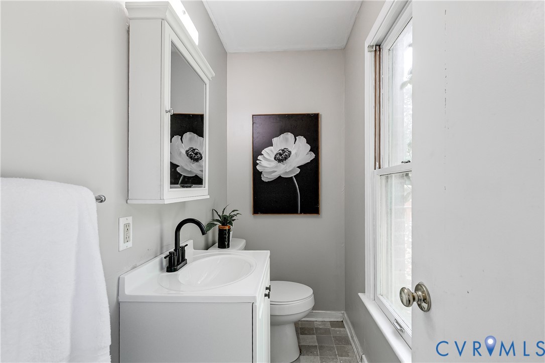 11211 Moravia Road Midlothian, VA 23112 - Photo 27 of 40 a bathroom with a toilet sink and mirror