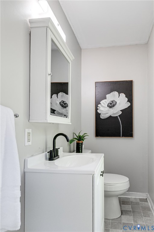 11211 Moravia Road Midlothian, VA 23112 - Photo 28 of 40 a bathroom with a sink and mirror with toilet