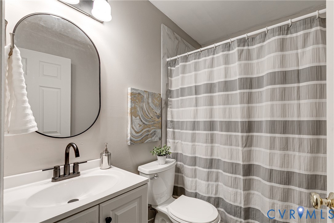 11211 Moravia Road Midlothian, VA 23112 - Photo 30 of 40 a bathroom with a sink and a mirror