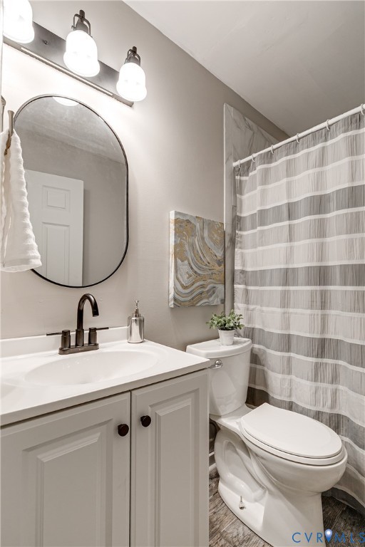 11211 Moravia Road Midlothian, VA 23112 - Photo 31 of 40 a bathroom with a sink toilet and mirror
