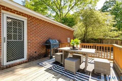 a view of a patio with wooden floor