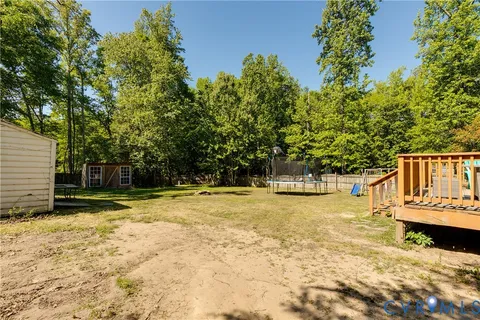 a view of a yard with swimming pool