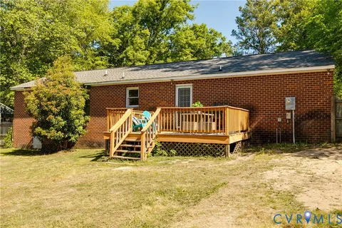 a view of a chairs and table in the back yard