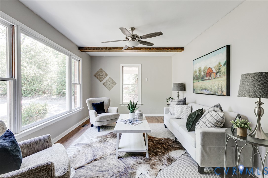 11211 Moravia Road Midlothian, VA 23112 - Photo 4 of 40 a living room with furniture and a large window