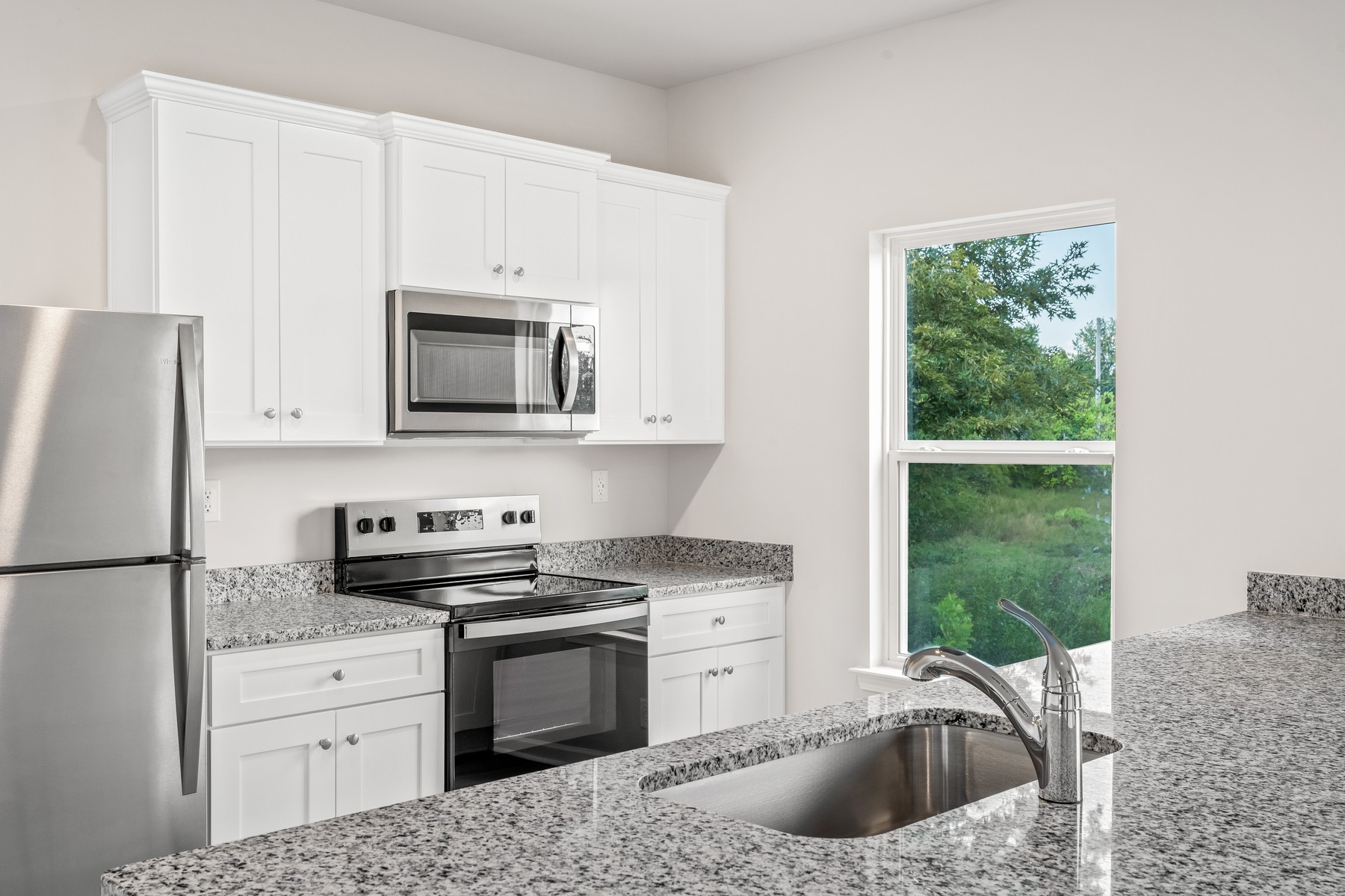 2012 Lala Loop White Bluff, TN 37187 - Photo 5 of 13 a kitchen with granite countertop a sink stove and refrigerator